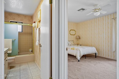 This spacious Southwest-style custom pool home is perfect for on Cerbat Cliffs Golf Course in Arizona - for sale on GolfHomes.com, golf home, golf lot