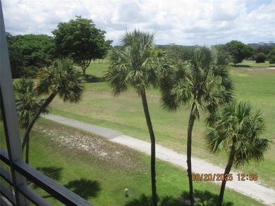 Lovely golf course view from large, screened patio (with on Palm-Aire Country Club and Resort - Palms in Florida - for sale on GolfHomes.com, golf home, golf lot