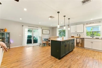 Nestled in an up-and-coming neighborhood backing up to a on Golden Gate Country Club in Florida - for sale on GolfHomes.com, golf home, golf lot