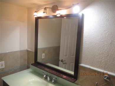 Lovely golf course view from large, screened patio (with on Palm-Aire Country Club and Resort - Palms in Florida - for sale on GolfHomes.com, golf home, golf lot