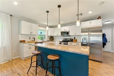 Nestled in an up-and-coming neighborhood backing up to a on Golden Gate Country Club in Florida - for sale on GolfHomes.com, golf home, golf lot