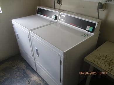 Lovely golf course view from large, screened patio (with on Palm-Aire Country Club and Resort - Palms in Florida - for sale on GolfHomes.com, golf home, golf lot