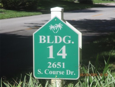 Lovely golf course view from large, screened patio (with on Palm-Aire Country Club and Resort - Palms in Florida - for sale on GolfHomes.com, golf home, golf lot