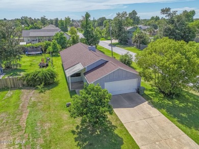 Well-maintained 3-bedroom, 2-bath home located in central Lynn on Panama Country Club in Florida - for sale on GolfHomes.com, golf home, golf lot