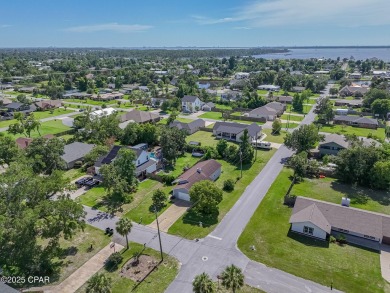 Well-maintained 3-bedroom, 2-bath home located in central Lynn on Panama Country Club in Florida - for sale on GolfHomes.com, golf home, golf lot