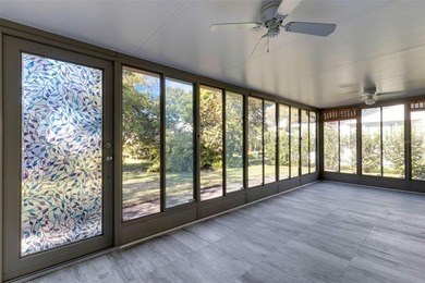 The ENCLOSED FLORIDA ROOM Under Heat and Air adds almost 450 sq on Highland Lakes Executive Golf Course in Florida - for sale on GolfHomes.com, golf home, golf lot