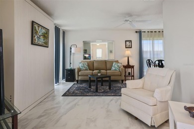 Sunlight pours into this charming one-bedroom, one-bath villa on Highland Lakes Executive Golf Course in Florida - for sale on GolfHomes.com, golf home, golf lot