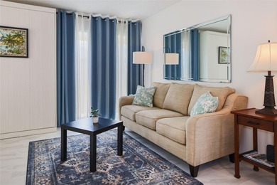 Sunlight pours into this charming one-bedroom, one-bath villa on Highland Lakes Executive Golf Course in Florida - for sale on GolfHomes.com, golf home, golf lot