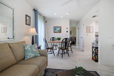 Under contract-accepting backup offers. Sunlight pours into this on Highland Lakes Executive Golf Course in Florida - for sale on GolfHomes.com, golf home, golf lot