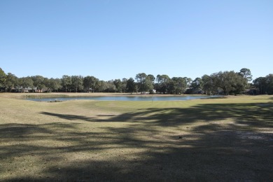 Gated community, nested on the 7th fairway of the Marsh golf on Bluewater Bay Resort in Florida - for sale on GolfHomes.com, golf home, golf lot