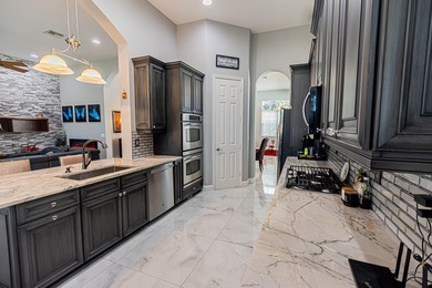 Impressive 3BR/3.5BA/2CG golf-front pool home in PGA Verano 4th on PGA Golf Club in PGA Village in Florida - for sale on GolfHomes.com, golf home, golf lot