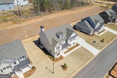Nestled in the sought-after Traditions of Braselton community on Traditions of Braselton Golf Club in Georgia - for sale on GolfHomes.com, golf home, golf lot