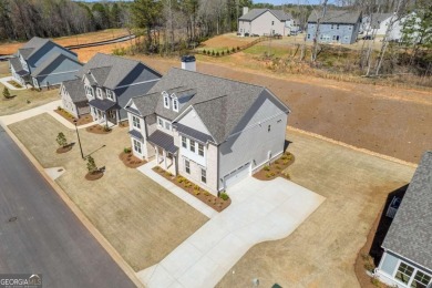 Nestled in the sought-after Traditions of Braselton community on Traditions of Braselton Golf Club in Georgia - for sale on GolfHomes.com, golf home, golf lot