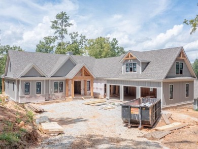 Welcome home to this stunning new construction, custom designed on Reynolds Lake Oconee - The Creek Club in Georgia - for sale on GolfHomes.com, golf home, golf lot