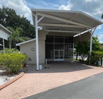 Nestled on a somewhat private lot in the 55+ Class A gated RV on Deer Creek RV Golf Resort in Florida - for sale on GolfHomes.com, golf home, golf lot