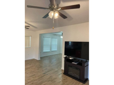 Nestled on a somewhat private lot in the 55+ Class A gated RV on Deer Creek RV Golf Resort in Florida - for sale on GolfHomes.com, golf home, golf lot