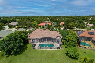 STUNNING, CUSTOM DESIGNED RESIDENCE, PERFECTLY SITUATED ON A 1/2 on The Legacy Golf and Tennis Club in Florida - for sale on GolfHomes.com, golf home, golf lot