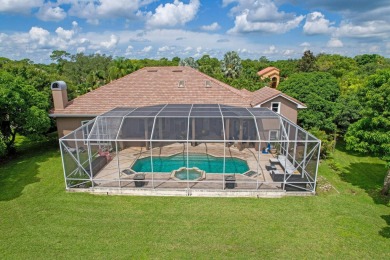 STUNNING, CUSTOM DESIGNED RESIDENCE, PERFECTLY SITUATED ON A 1/2 on The Legacy Golf and Tennis Club in Florida - for sale on GolfHomes.com, golf home, golf lot