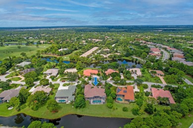 STUNNING, CUSTOM DESIGNED RESIDENCE, PERFECTLY SITUATED ON A 1/2 on The Legacy Golf and Tennis Club in Florida - for sale on GolfHomes.com, golf home, golf lot