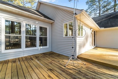 Experience modern living in this contemporary split-level home on Deercroft Golf and Country Club in North Carolina - for sale on GolfHomes.com, golf home, golf lot