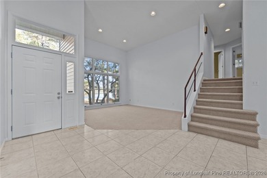 Experience modern living in this contemporary split-level home on Deercroft Golf and Country Club in North Carolina - for sale on GolfHomes.com, golf home, golf lot