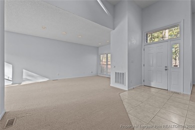 Experience modern living in this contemporary split-level home on Deercroft Golf and Country Club in North Carolina - for sale on GolfHomes.com, golf home, golf lot