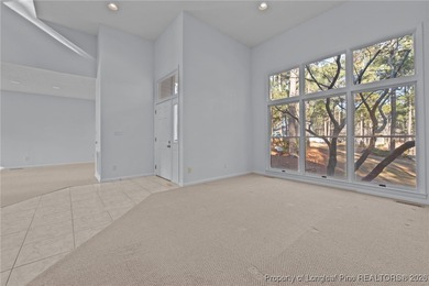 Experience modern living in this contemporary split-level home on Deercroft Golf and Country Club in North Carolina - for sale on GolfHomes.com, golf home, golf lot