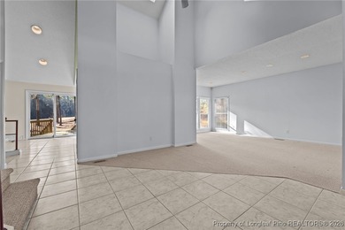 Experience modern living in this contemporary split-level home on Deercroft Golf and Country Club in North Carolina - for sale on GolfHomes.com, golf home, golf lot