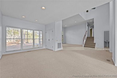 Experience modern living in this contemporary split-level home on Deercroft Golf and Country Club in North Carolina - for sale on GolfHomes.com, golf home, golf lot