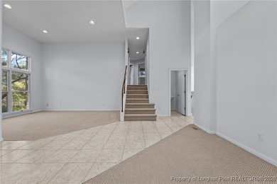 Experience modern living in this contemporary split-level home on Deercroft Golf and Country Club in North Carolina - for sale on GolfHomes.com, golf home, golf lot