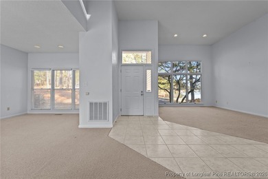 Experience modern living in this contemporary split-level home on Deercroft Golf and Country Club in North Carolina - for sale on GolfHomes.com, golf home, golf lot