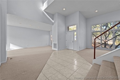 Experience modern living in this contemporary split-level home on Deercroft Golf and Country Club in North Carolina - for sale on GolfHomes.com, golf home, golf lot