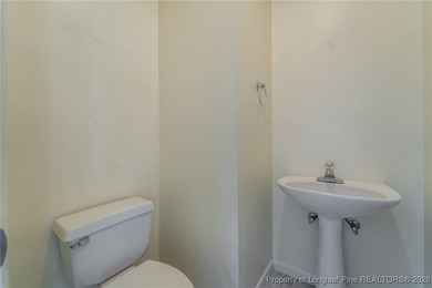 Experience modern living in this contemporary split-level home on Deercroft Golf and Country Club in North Carolina - for sale on GolfHomes.com, golf home, golf lot