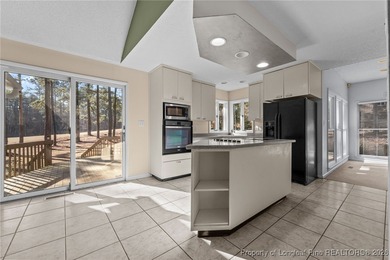 Experience modern living in this contemporary split-level home on Deercroft Golf and Country Club in North Carolina - for sale on GolfHomes.com, golf home, golf lot