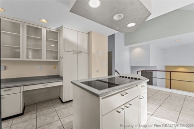 Experience modern living in this contemporary split-level home on Deercroft Golf and Country Club in North Carolina - for sale on GolfHomes.com, golf home, golf lot