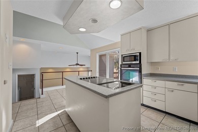 Experience modern living in this contemporary split-level home on Deercroft Golf and Country Club in North Carolina - for sale on GolfHomes.com, golf home, golf lot