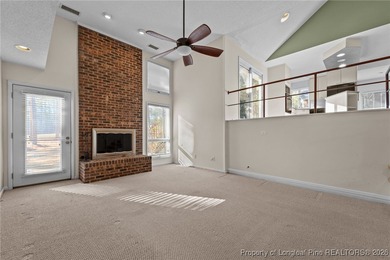 Experience modern living in this contemporary split-level home on Deercroft Golf and Country Club in North Carolina - for sale on GolfHomes.com, golf home, golf lot