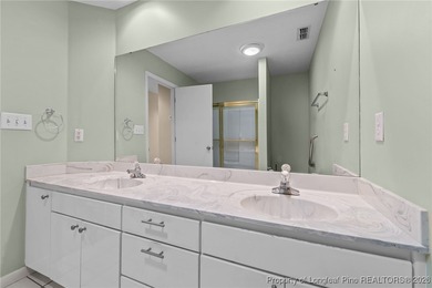 Experience modern living in this contemporary split-level home on Deercroft Golf and Country Club in North Carolina - for sale on GolfHomes.com, golf home, golf lot