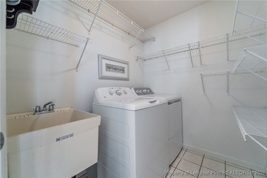 Experience modern living in this contemporary split-level home on Deercroft Golf and Country Club in North Carolina - for sale on GolfHomes.com, golf home, golf lot