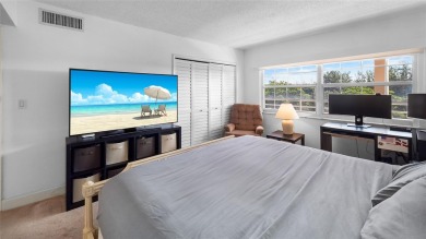 Experience the charm of Palm Aire in this beautifully updated on Palm-Aire Country Club and Resort - The Oaks in Florida - for sale on GolfHomes.com, golf home, golf lot