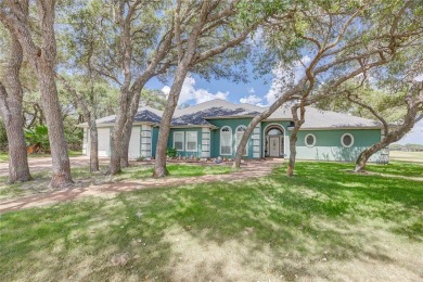 Welcome to 13th Fairway that hosts a beautifully appointed on Rockport Country Club in Texas - for sale on GolfHomes.com, golf home, golf lot