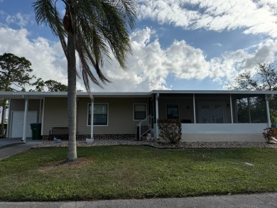 This great manufactured home on leased land is located in Lake on Pine Lakes Country Club in Florida - for sale on GolfHomes.com, golf home, golf lot