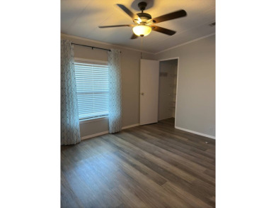 This great manufactured home on leased land is located in Lake on Pine Lakes Country Club in Florida - for sale on GolfHomes.com, golf home, golf lot