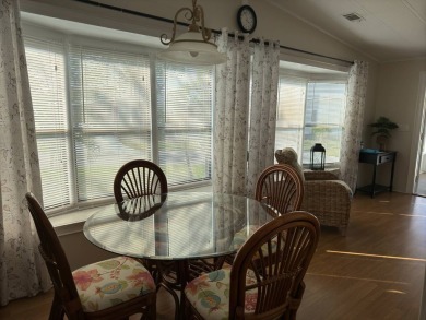 This great manufactured home on leased land is located in Lake on Pine Lakes Country Club in Florida - for sale on GolfHomes.com, golf home, golf lot