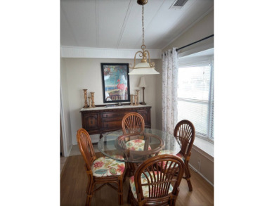 This great manufactured home on leased land is located in Lake on Pine Lakes Country Club in Florida - for sale on GolfHomes.com, golf home, golf lot