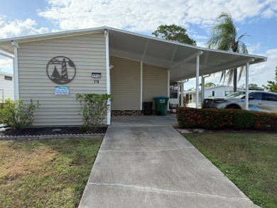 This great manufactured home on leased land is located in Lake on Pine Lakes Country Club in Florida - for sale on GolfHomes.com, golf home, golf lot