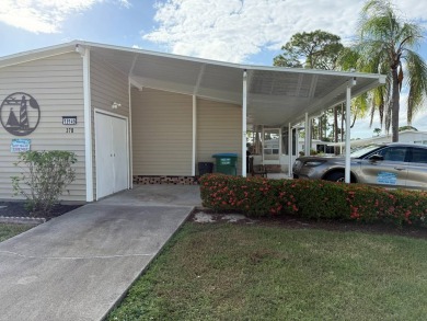 This great manufactured home on leased land is located in Lake on Pine Lakes Country Club in Florida - for sale on GolfHomes.com, golf home, golf lot