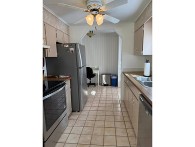This great manufactured home on leased land is located in Lake on Pine Lakes Country Club in Florida - for sale on GolfHomes.com, golf home, golf lot