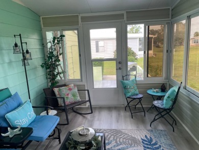 TIRED OF SNOW,ICE AND COLD, TRADE IT IN FOR SUN,WARM AND WHITE on Lake Fairways Country Club in Florida - for sale on GolfHomes.com, golf home, golf lot