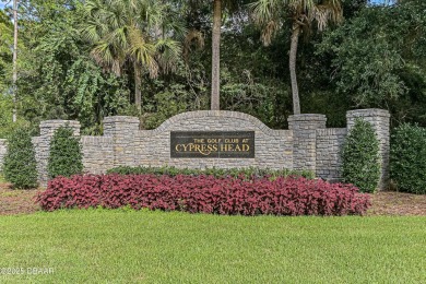 Welcome to this charming three-bedroom, two-bathroom home with on The Golf Club At Cypress Head in Florida - for sale on GolfHomes.com, golf home, golf lot
